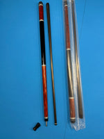 A set of pool cues shown disassembled and packaged on a solid blue background. The set includes two wooden cue shafts with black and red sections, one fully assembled cue, and another cue inside a clear plastic sleeve.